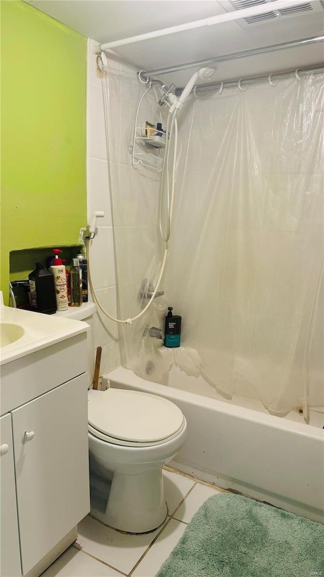 full bathroom with tile patterned flooring, vanity, toilet, and shower / bath combo with shower curtain