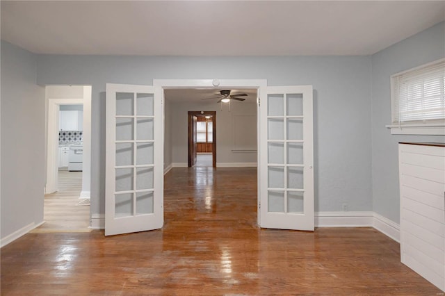 empty room featuring wood-type flooring and ceiling fan