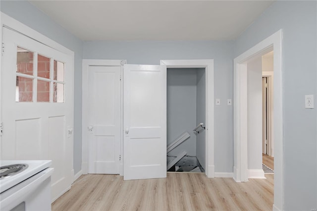 interior space featuring light hardwood / wood-style floors and electric stove