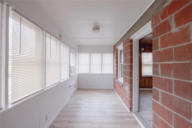 unfurnished sunroom featuring plenty of natural light