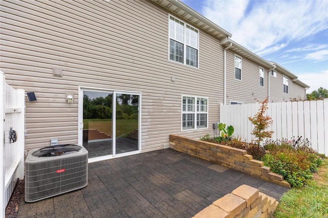 back of house with a patio and central AC unit