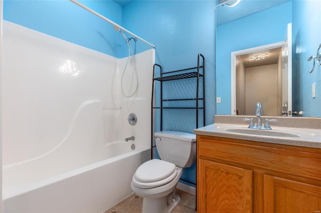 full bathroom featuring tub / shower combination, vanity, toilet, and tile patterned floors