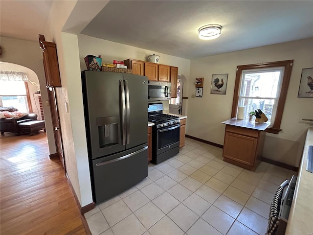 kitchen featuring appliances with stainless steel finishes and light wood-type flooring