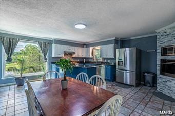 dining space with crown molding