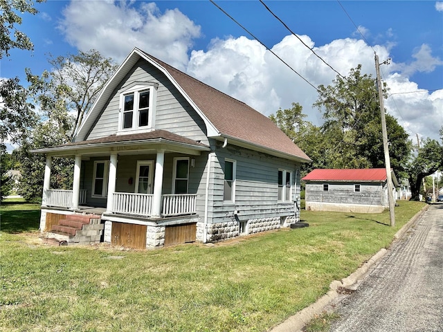 view of front of house with a front yard and covered porch