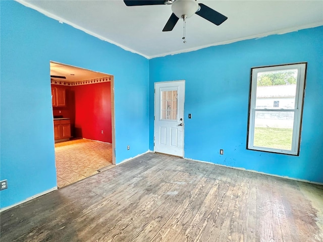 unfurnished room featuring ceiling fan and hardwood / wood-style floors