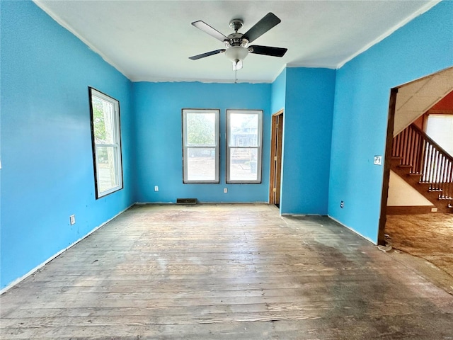 interior space featuring wood-type flooring and ceiling fan