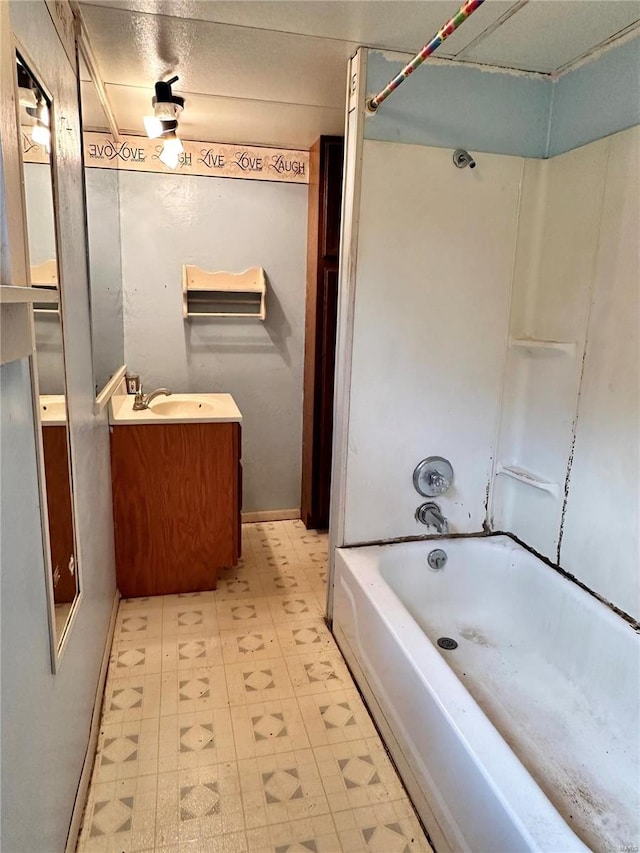 bathroom featuring bathing tub / shower combination and vanity