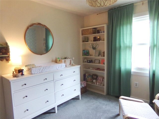 bedroom featuring light colored carpet