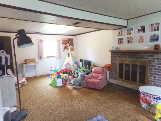 rec room with carpet floors, a brick fireplace, and visible vents