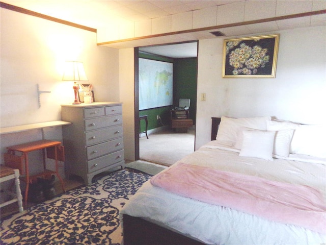 bedroom with carpet floors and visible vents