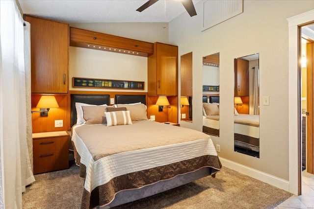 bedroom featuring lofted ceiling, ceiling fan, and light colored carpet