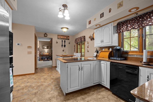 kitchen featuring dishwasher, white cabinetry, kitchen peninsula, an inviting chandelier, and stone countertops