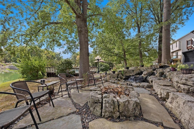 view of patio with a water view