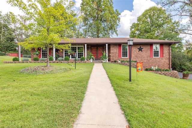 single story home with a front yard