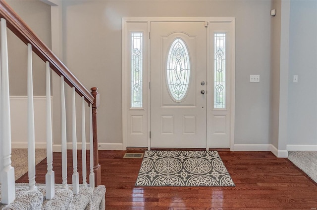 foyer with dark wood-type flooring