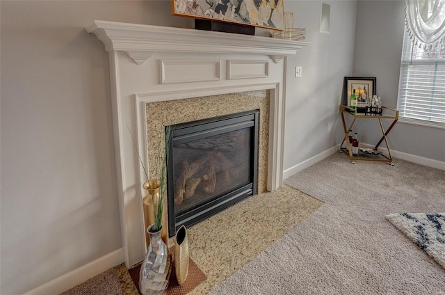 details featuring a high end fireplace and carpet floors