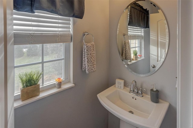 bathroom featuring sink and a healthy amount of sunlight