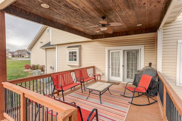 wooden terrace with area for grilling, ceiling fan, and central AC unit