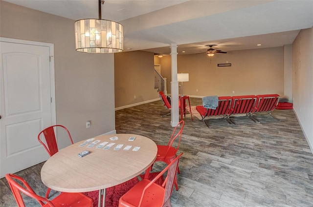 dining area featuring dark hardwood / wood-style flooring and ceiling fan