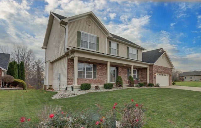 view of front of home featuring a garage and a front yard