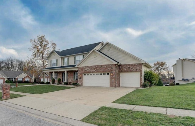 view of front of home with a garage and a front lawn