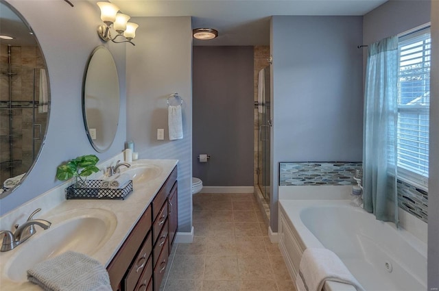 full bathroom featuring toilet, vanity, tile patterned floors, and independent shower and bath