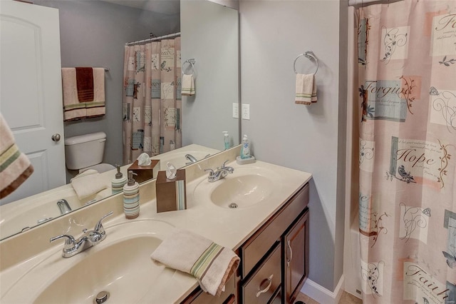 full bathroom with shower / tub combo, vanity, and toilet