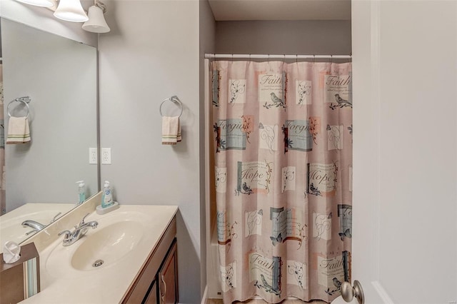 bathroom featuring vanity and walk in shower