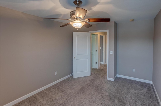 unfurnished bedroom featuring light colored carpet and ceiling fan