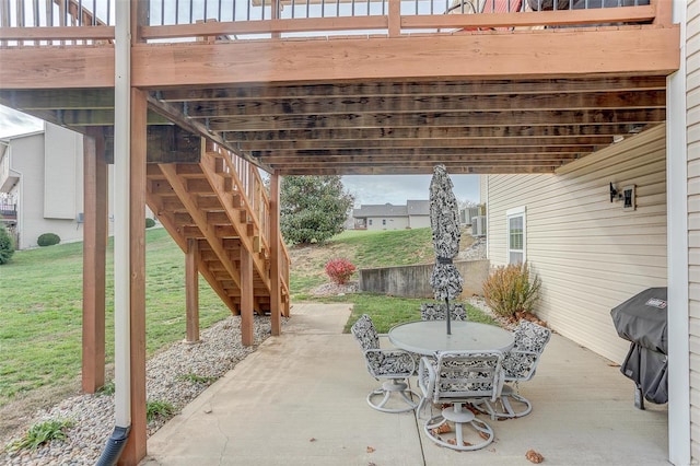 view of patio featuring area for grilling and a wooden deck