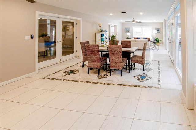 dining space featuring ceiling fan, light tile patterned floors, and french doors