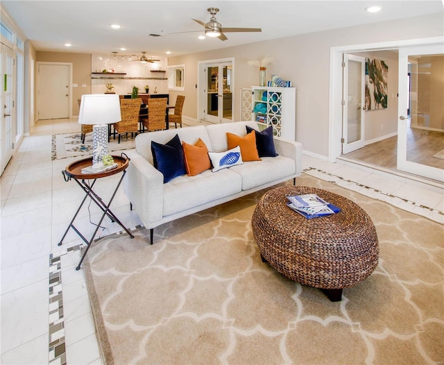 tiled living room with ceiling fan