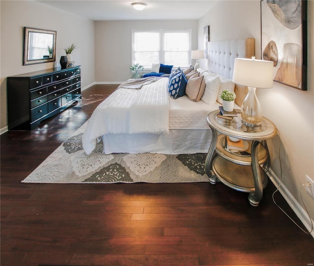 bedroom featuring dark hardwood / wood-style flooring