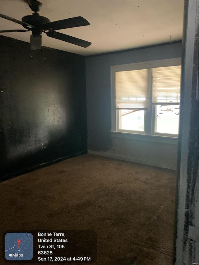 carpeted empty room with ceiling fan