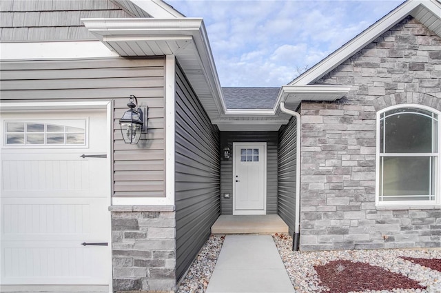 doorway to property featuring a garage