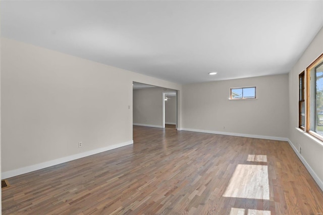 unfurnished room featuring wood-type flooring