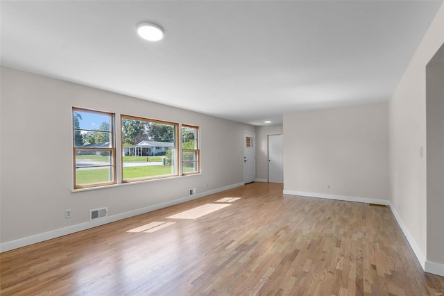 spare room with light hardwood / wood-style floors