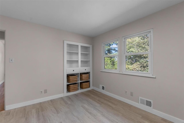 unfurnished room featuring light hardwood / wood-style flooring