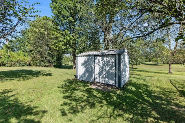 view of outdoor structure with a lawn