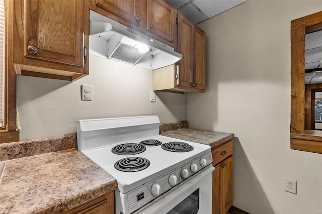 kitchen featuring white range with electric stovetop