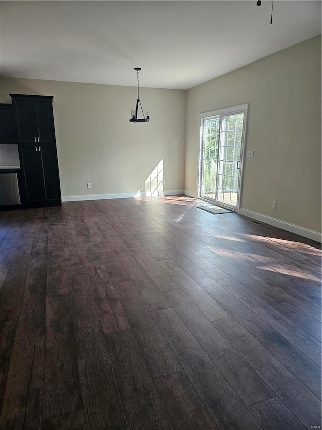 spare room with dark wood-type flooring