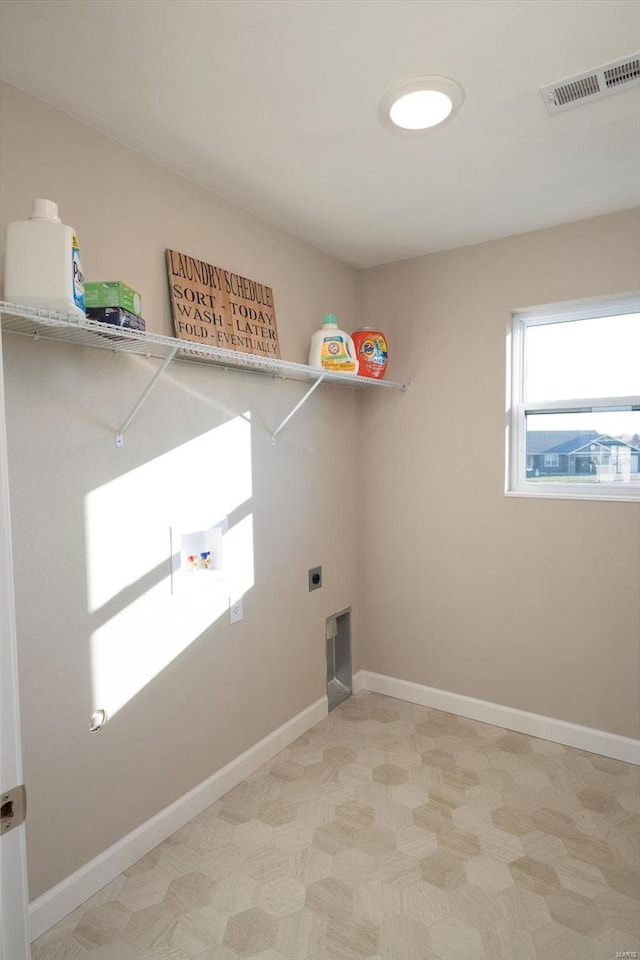 washroom with hookup for an electric dryer and hookup for a washing machine