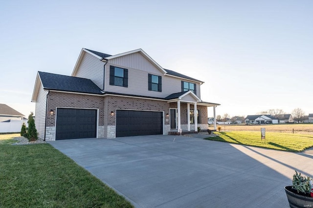 view of front of house featuring a front yard and a garage