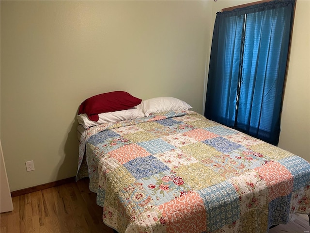 bedroom featuring hardwood / wood-style floors