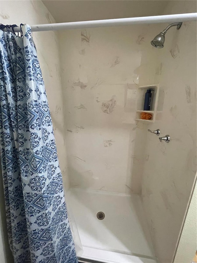 bathroom featuring walk in shower