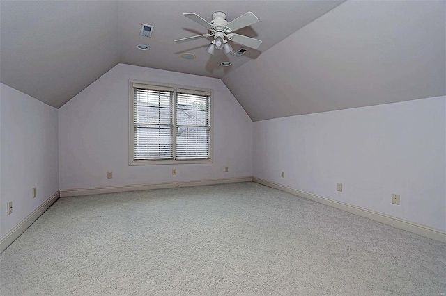 bonus room featuring vaulted ceiling, light colored carpet, and ceiling fan