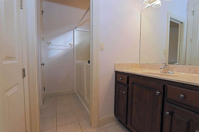 bathroom with vanity and tile patterned flooring