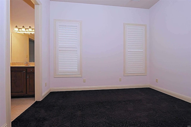 spare room featuring light colored carpet