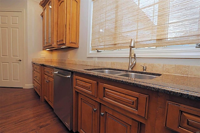 kitchen with stainless steel dishwasher, sink, and dark hardwood / wood-style flooring